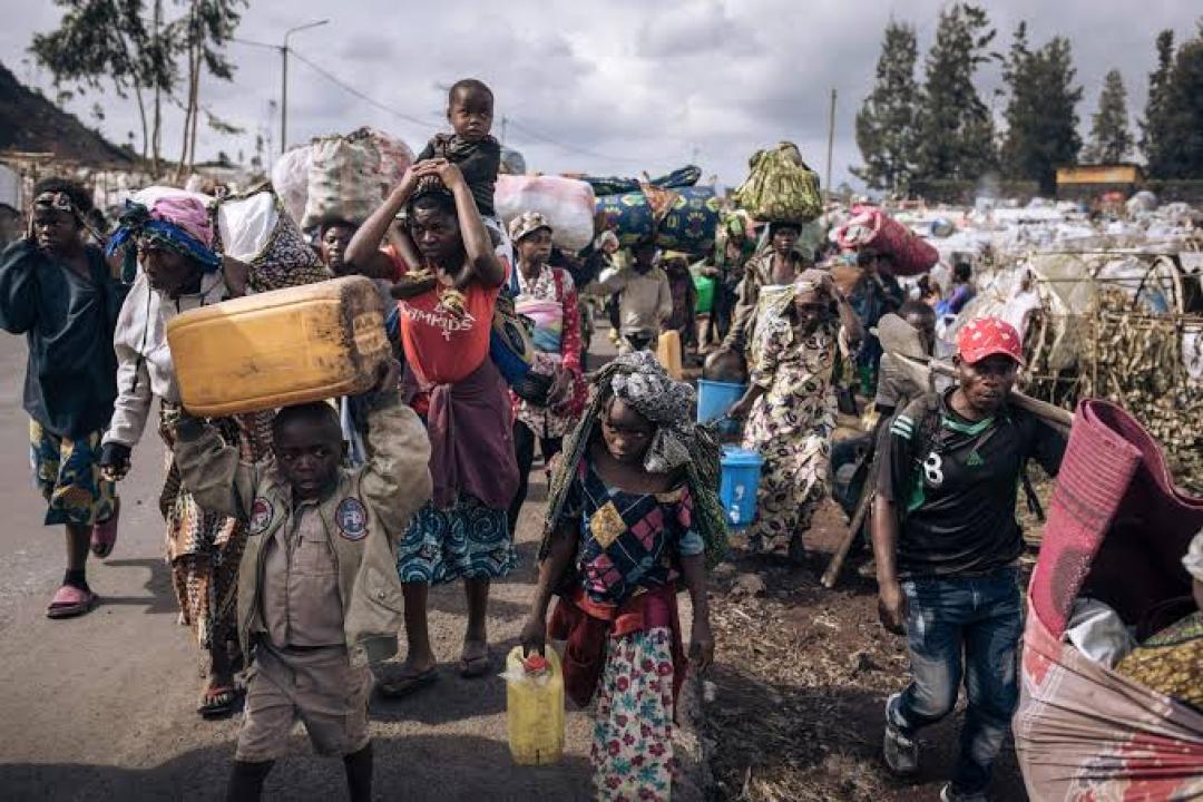 Des habitants fuyant les terroristes du M23